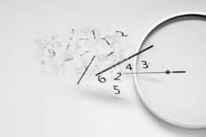 Clock face breaking apart into scattered numbers, representing time being lost or wasted during inefficient board exam study.